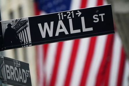 A Wall Street sign is pictured outside the New York Stock Exchange in the Manhattan borough of New York City, New York, U.S., October 2, 2020. REUTERS/Carlo Allegri