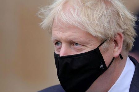 Britain's Prime Minister Boris Johnson looks on after a service marking Armistice Day at Westminster Abbey in London, Britain November 11, 2020. Aaron Chown/PA Wire/Pool via REUTERS
