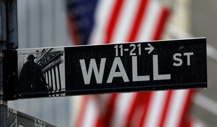 Raindrops hang on a sign for Wall Street outside the New York Stock Exchange in Manhattan in New York City, New York, U.S., October 26, 2020. REUTERS/Mike Segar