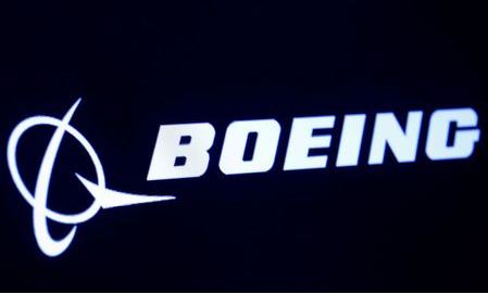 The company logo for Boeing is displayed on a screen on the floor of the New York Stock Exchange (NYSE) in New York, U.S., March 11, 2019. REUTERS/Brendan McDermid/File Photo