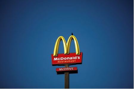 The McDonald's company logo stands on a sign outside a restaurant in Bretigny-sur-Orge, near Paris, France, July 30, 2020. REUTERS/Benoit Tessier