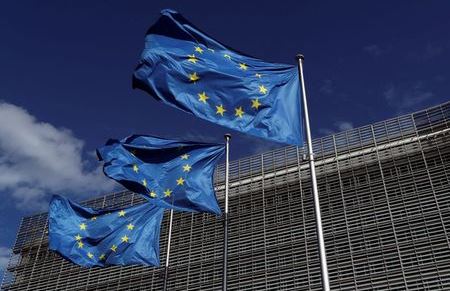 European Union flags flutter outside the European Commission headquarters in Brussels, Belgium August 21, 2020. REUTERS/Yves Herman