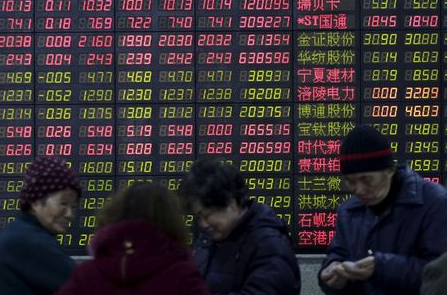 FILE PHOTO: Investors stand in front of an electronic board showing stock information on the first trading day after the week-long Lunar New Year holiday at a brokerage house in Shanghai, China, February 15, 2016. China stocks opened more than 2 percent lower on Monday, as they played catch-up with bearish global markets after the week-long Lunar New Year holiday. REUTERS/Aly Song/File Photo