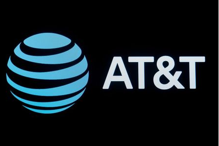 FILE PHOTO: The company logo for AT&T is displayed on a screen on the floor at the New York Stock Exchange (NYSE) in New York, U.S., September 18, 2019. REUTERS/Brendan McDermid/File Photo