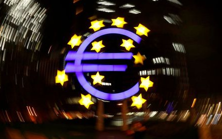 FILE PHOTO: The euro sign is photographed in front of the former head quarter of the European Central Bank in Frankfurt, Germany, April 9, 2019. Picture is taken on slow shutter speed while the camera was moved. REUTERS/Kai Pfaffenbach/File Photo