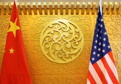 FILE PHOTO: Chinese and U.S. flags are set up for a meeting at China's Ministry of Transport in Beijing, China April 27, 2018. REUTERS/Jason Lee