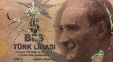 Turkish lira banknote is seen through broken glass in this illustration taken June 25, 2021. REUTERS/Dado Ruvic/Illustration