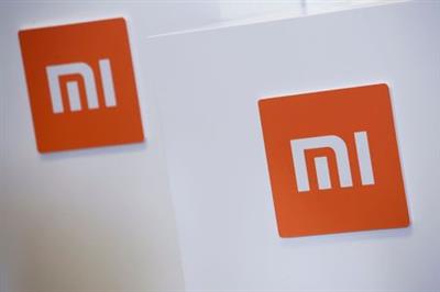 FILE PHOTO: Xiaomi logos are seen in Hong Kong, China June 23, 2018. REUTERS/Bobby Yip
