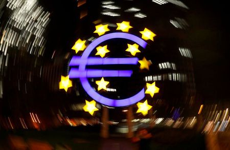 FILE PHOTO: The euro sign is photographed in front of the former head quarter of the European Central Bank in Frankfurt, Germany, April 9, 2019. REUTERS/Kai Pfaffenbach 